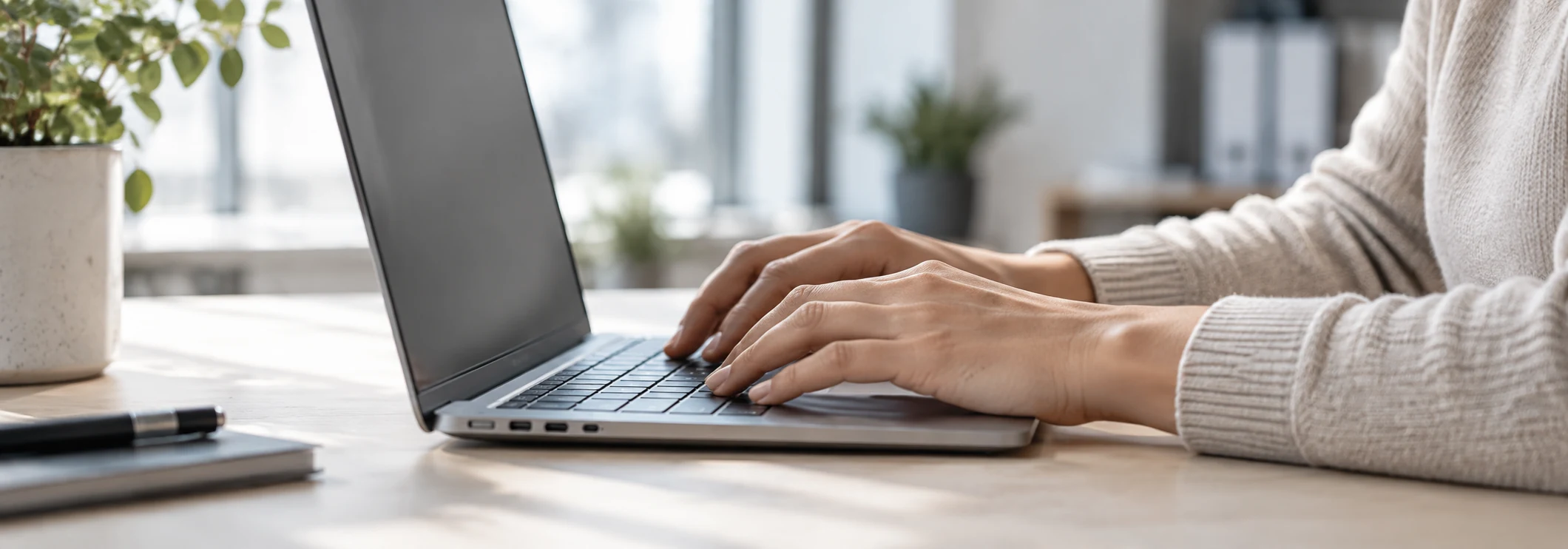 An administrator prepares work on a laptop